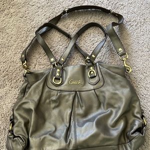 Coach bag bronze color with black interior. Magnetic closure. Several pockets.